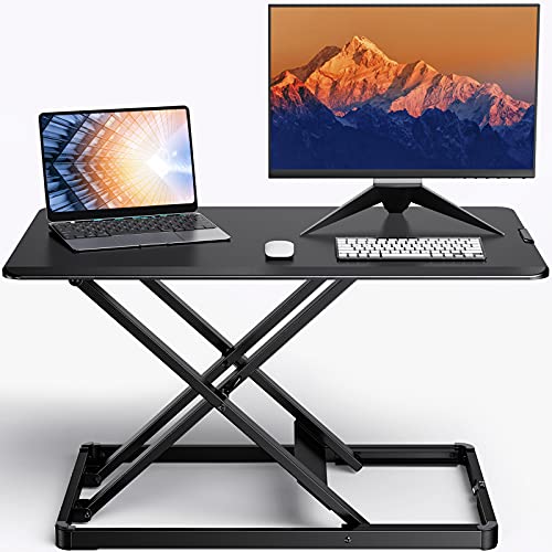 Photo 1 of Standing Desk Converter Height Adjustable Stand Up Desktop Riser, 28" Ergonomic Gas Spring Sit to Stand Workstation for Laptop and Monitor Home Office 
