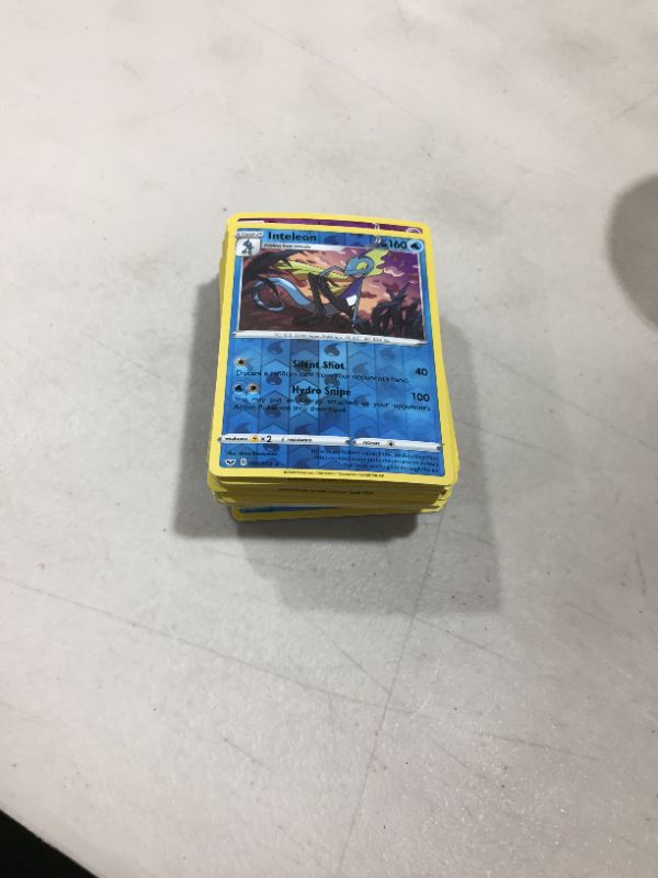 Photo 2 of 100 Assorted Pokemon Cards - 1 GX OR V Ultra Rare and 100 Additonal Common/Uncommons Cards - Includes Golden Groundhog Treasure Chest Storage Box