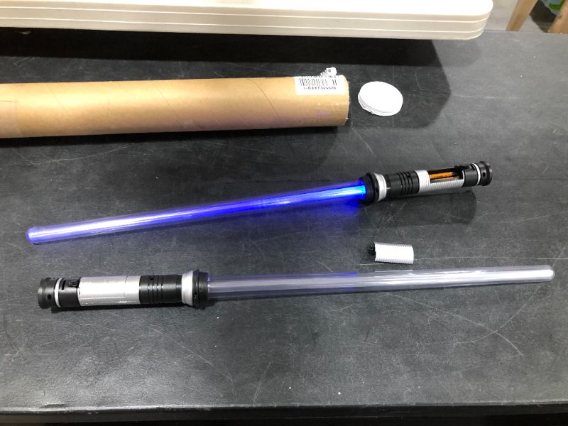 Photo 1 of 2 PIECE ELECTRONIC LIGHTSABER TOY