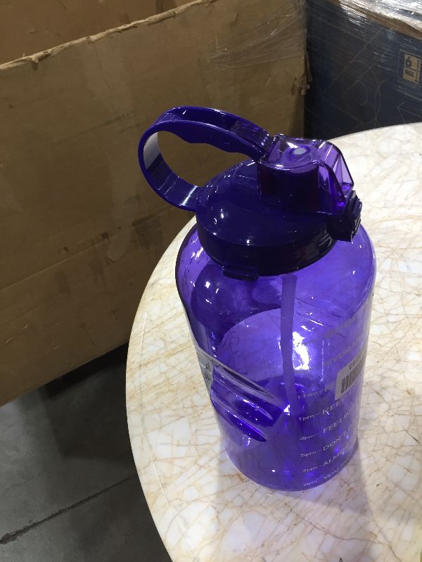 Photo 1 of 128 oz water jug 