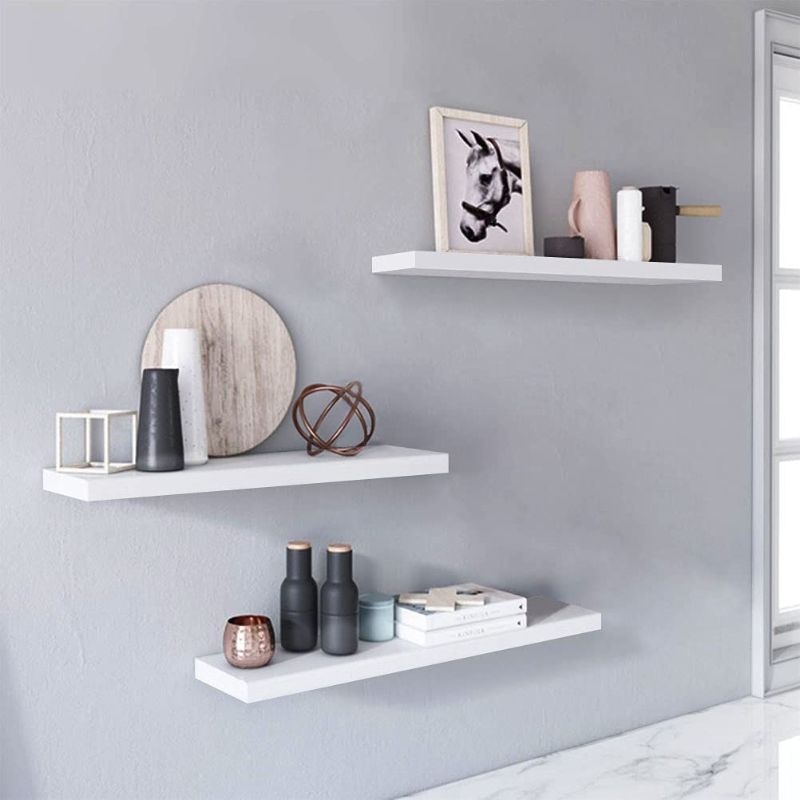 Photo 1 of White Floating Wall Shelves,Pack of 3 Wall Mounted Ledge Hanging Modern Wood Shelf Wall Storage Shelves for Bedroom, Living Room, Bathroom, Kitchen, Office and More