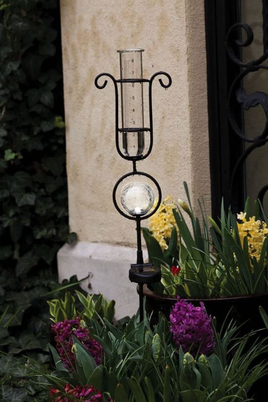 Photo 1 of Evergreen Garden Metal and Glass Rain Gauge with Solar Powered Light - 6" W x 5.5" D x 33.5" H
