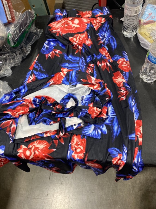 Photo 1 of black with red and blue floral print, bathing suite with side slit skirt and front tie cropped shirt