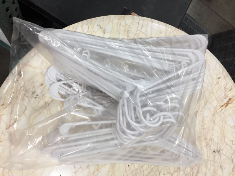 Photo 1 of 50 count of white hangers