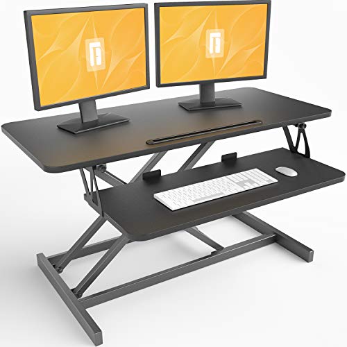 Photo 2 of FEZIBO Standing Desk Converter 36 inches Sit Stand Desk Riser Stand up Desk Tabletop Workstation fits Dual Monitor Black