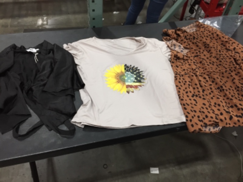 Photo 1 of 3 pack womens clothing-  Tan shirt size large, animal print size 2 xl, black top size 4- Sold as is