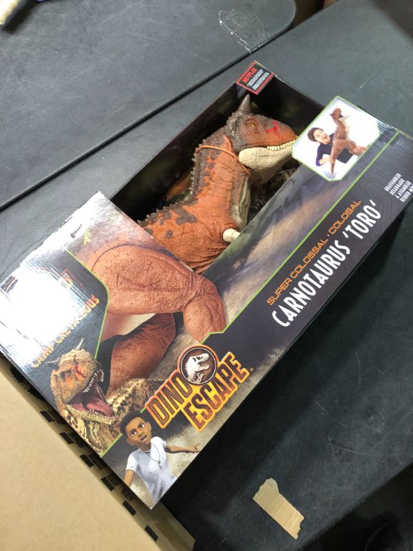 Photo 1 of Jurassic World Colossal Carnotaurus Toro Dinosaur Action Figure Camp Cretaceous with Stomach-Release Feature, 36-in Long, Realistic Sculpting, Kid Gift Age 4 Years & Up