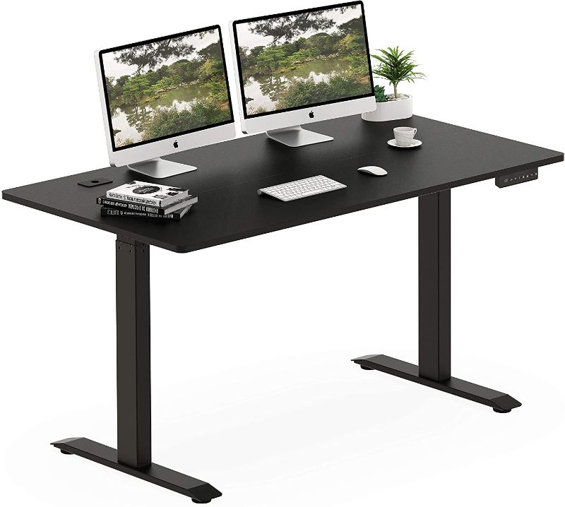 Photo 1 of SHW 55-Inch Large Electric Height Adjustable Standing Desk, 55 x 28 Inches, Black