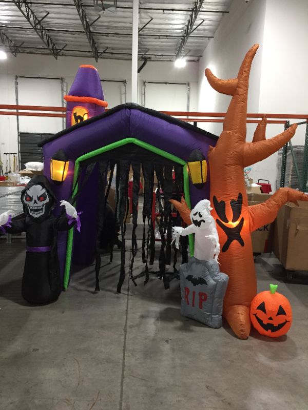 Photo 2 of  8.5 Foot Halloween Inflatable Haunted House Castle with Skeleton, Ghost & Skulls
