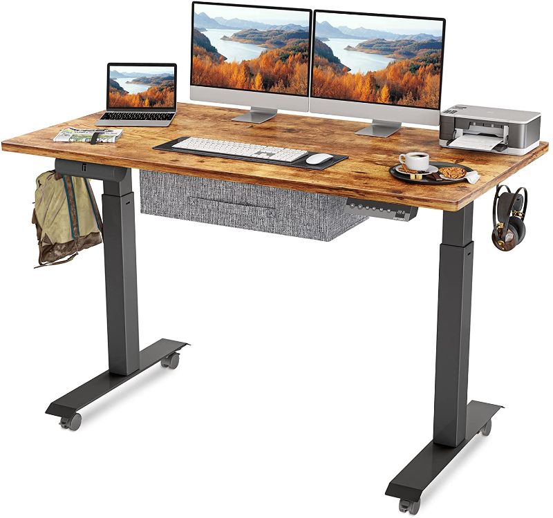 Photo 1 of FEZIBO Electric Height Adjustable Standing Desk with Drawer, 63 x 24 Inches Splice Board, Black Frame/Rustic Brown Top