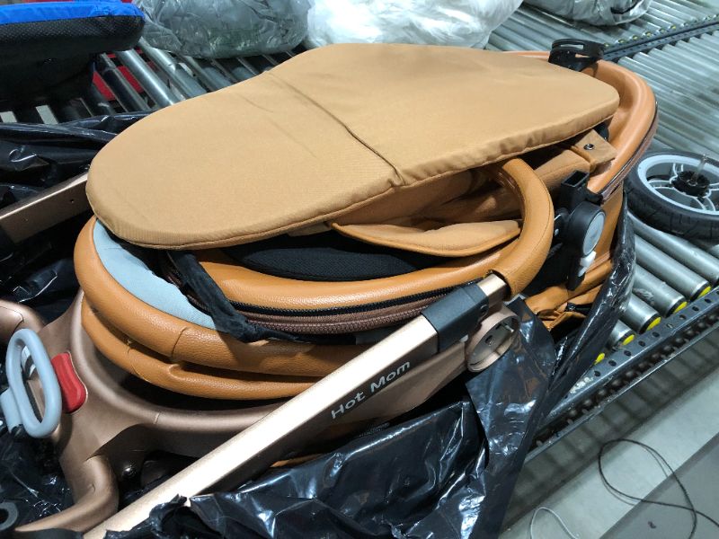 Photo 4 of Hot Mom New Arrival Leather Baby Stroller Baby Car Four Wheels Egg Shape Baby Pram Trolley Brown
