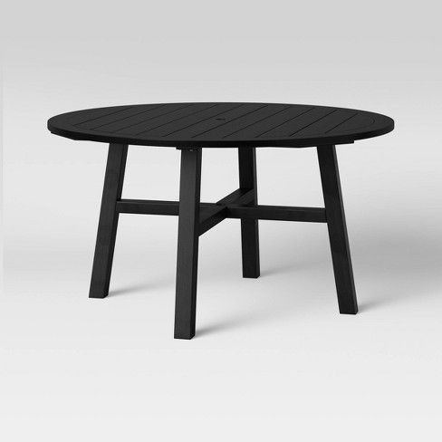 Photo 1 of Blackened Wood 4 Person Round Patio Dining Table - Smith & Hawken
