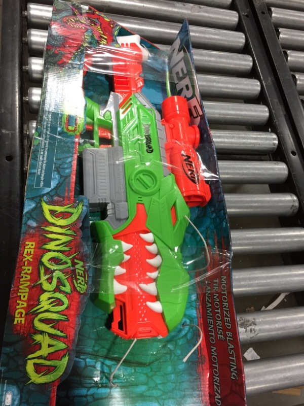 Photo 2 of NERF DinoSquad Rex-Rampage Motorized Dart Blaster, 10-Dart Clip, 20 Official Darts, 10-Dart Storage- T-Rex Dinosaur Design , Red
