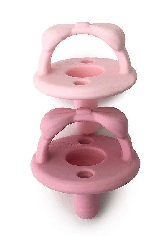 Photo 1 of Itzy Ritzy Sweetie Soother Pacifier Set of 4- Silicone Newborn Pacifiers with Collapsible Handle & Two Air Holes for Added Safety; Set of 2 in Light Pink & Dark Pink, Ages Newborn & Up
