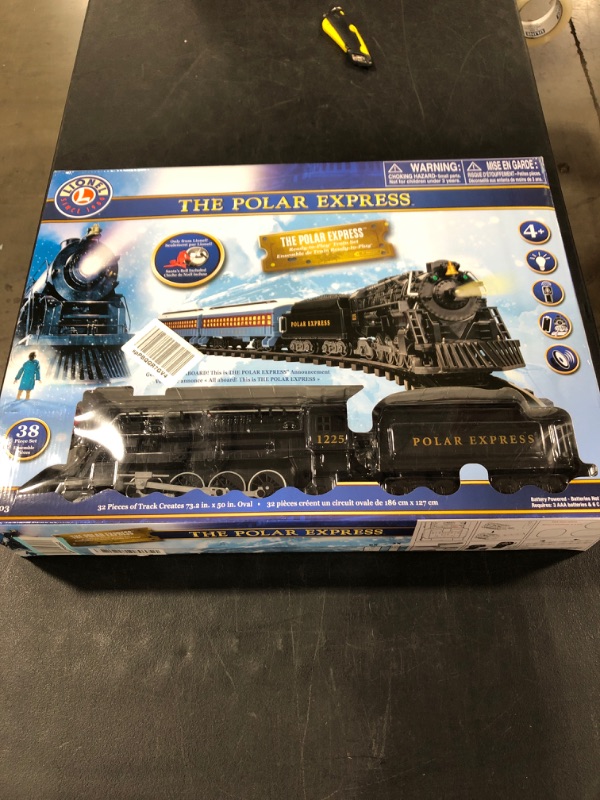Photo 1 of Lionel The Polar Express battery-powered Train Set with Remote + 12-Piece Straight Track Expansion Pack
