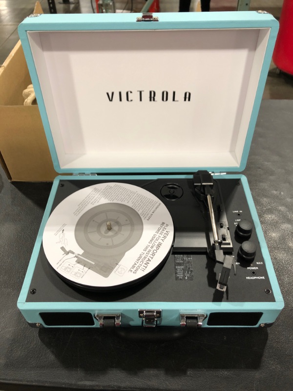 Photo 3 of Victrola Vintage 3-Speed Bluetooth Portable Suitcase Record Player with Built-in Speakers | Upgraded Turntable Audio Sound| Includes Extra Stylus | Turquoise, Model Number: VSC-550BT
OPEN BOX.