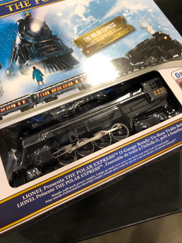 Photo 3 of Lionel The Polar Express Electric O Gauge Model Train Set with Remote and Bluetooth + 4-Piece Straight Track Expansion
