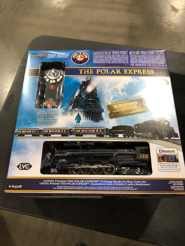 Photo 2 of Lionel The Polar Express Electric O Gauge Model Train Set with Remote and Bluetooth + 4-Piece Straight Track Expansion
