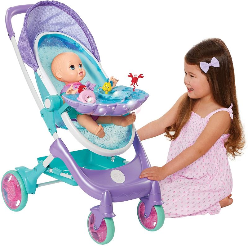 Photo 1 of My Disney Nursery Musical Bubble Baby Doll Stroller Inspired by The Little Mermaid, 4-in-1 Feature Doll Stroller, Forup to 14" Baby Dolls, Blows Bubbles & Plays Under The Sea for Girls Ages 3+
