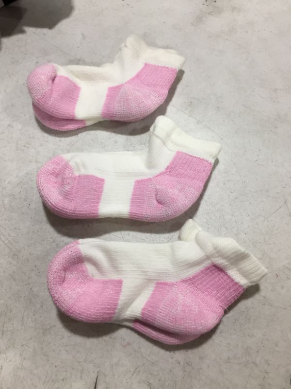 Photo 1 of 3 Paira of pink and white socks, size unknown possibly womens M