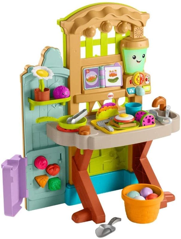 Photo 1 of Fisher-Price Laugh & Learn Grow-the-Fun Garden to Kitchen, Interactive Farm-to-Kitchen Playset for Toddlers with Music, Lights and Learning Content
