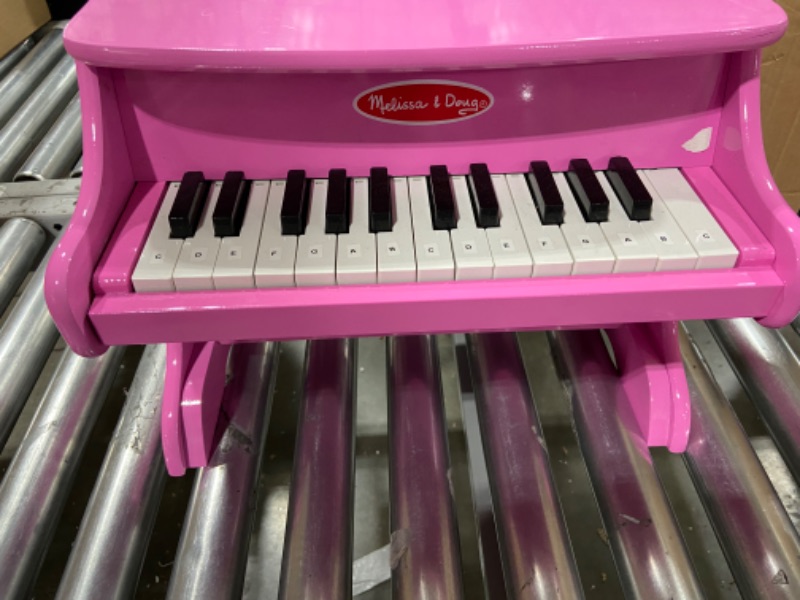 Photo 2 of Melissa & Doug Learn-to-Play Pink Piano With 25 Keys and Color-Coded Songbook
