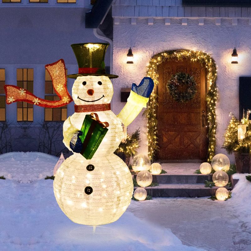 Photo 1 of DearHouse 4Ft Collapsible Lighted Christmas Snowman with Removable Hands&Scarf,Pre-Lit LED Light Up Snowman with Top Hat,for Holiday Xmas Decorations
