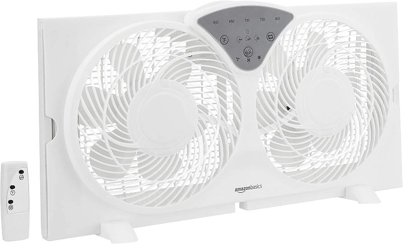 Photo 1 of Amazon Basics Digital Window Fan with Twin 9-Inch Reversible Airflow Blades and Remote Control