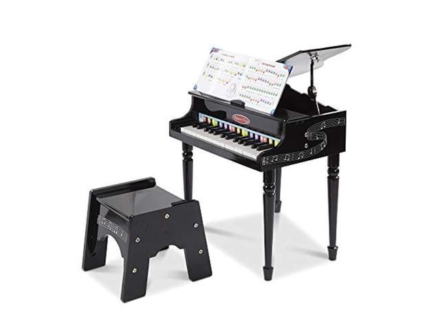 Photo 1 of Melissa & Doug Learn-to-play Classic Grand Piano, Mini Keyboard with 30 Hand-tuned Keys (23.65? H X 21.4? W X 10.05? L, E-commerce Packaging)
