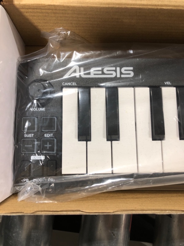 Photo 3 of Alesis Qmini - Portable 32 Key USB MIDI Keyboard Controller with Velocity Sensitive Synth Action Keys
