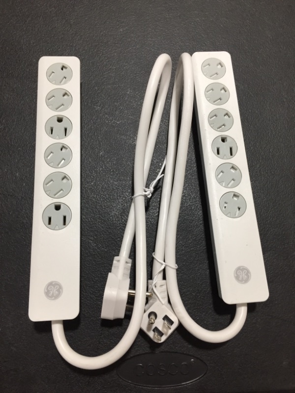 Photo 1 of GE 6 Outlet Surge Protector 2 Pack, 2 Ft Extension Cord, Power Strip, 450 Joules, Twist-to-Close Safety Covers, White, 54625