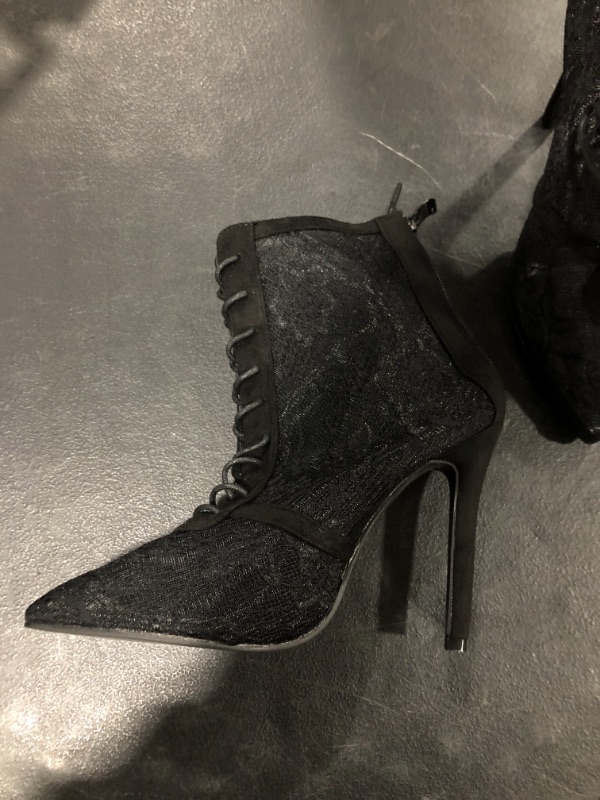 Photo 2 of Black womens high heel boots (Size 8)