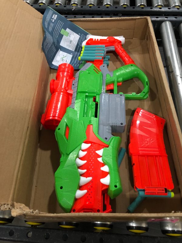 Photo 2 of NERF DinoSquad Rex-Rampage Motorized Dart Blaster, 10-Dart Clip, 20 Official Darts, 10-Dart Storage- T-Rex Dinosaur Design
