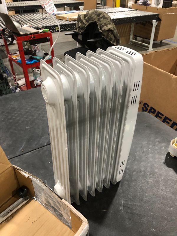 Photo 1 of PELONIS PHO15A2AGW, Basic Electric Oil Filled Radiator, 1500W Portable Full Room Radiant Space Heater with Adjustable Thermostat, White, 26.10 x 14.20 x 11.00

