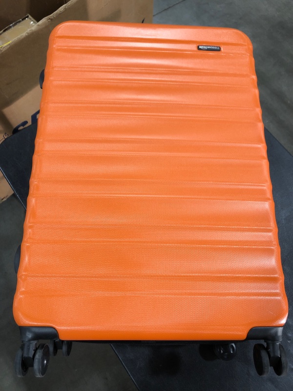 Photo 2 of AmazonBasics Hardside Spinner, Carry-On, Expandable Suitcase Luggage with Wheels, 30 Inch, Orange