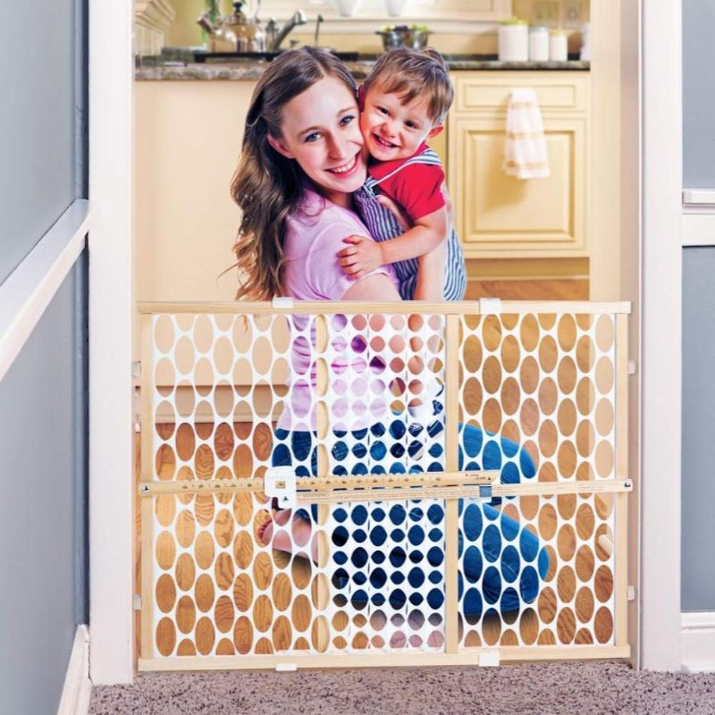 Photo 1 of Toddleroo by North States 42" Wide Quick Fit Oval Mesh Baby Gate: Easy Installation with Memory Feature. Pressure Mount. Fits 26.5"- 42" Wide (23"Tall, Sustainable Hardwood & White Oval Mesh)
