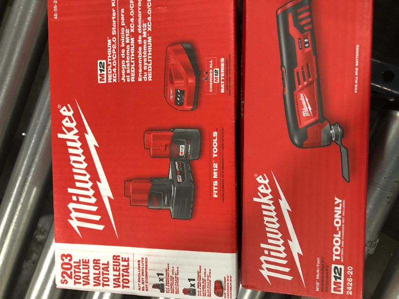 Photo 3 of 2pk MILWAUKEE'S 2426-20 M12 12 Volt Redlithium Ion 20,000 OPM Variable Speed Cordless Multi Tool with Multi-Use Blade, Sanding Pad, and Multi-Grit Sanding Papers & Milwaukee M12 12-Volt Lithium-Ion 4.0 Ah and 2.0 Ah Battery Packs and Charger Starter Kit 4