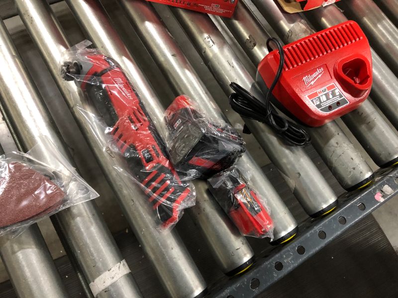 Photo 3 of 2pk MILWAUKEE'S 2426-20 M12 12 Volt Redlithium Ion 20,000 OPM Variable Speed Cordless Multi Tool with Multi-Use Blade, Sanding Pad, and Multi-Grit Sanding Papers & Milwaukee M12 12-Volt Lithium-Ion 4.0 Ah and 2.0 Ah Battery Packs and Charger Starter Kit 4