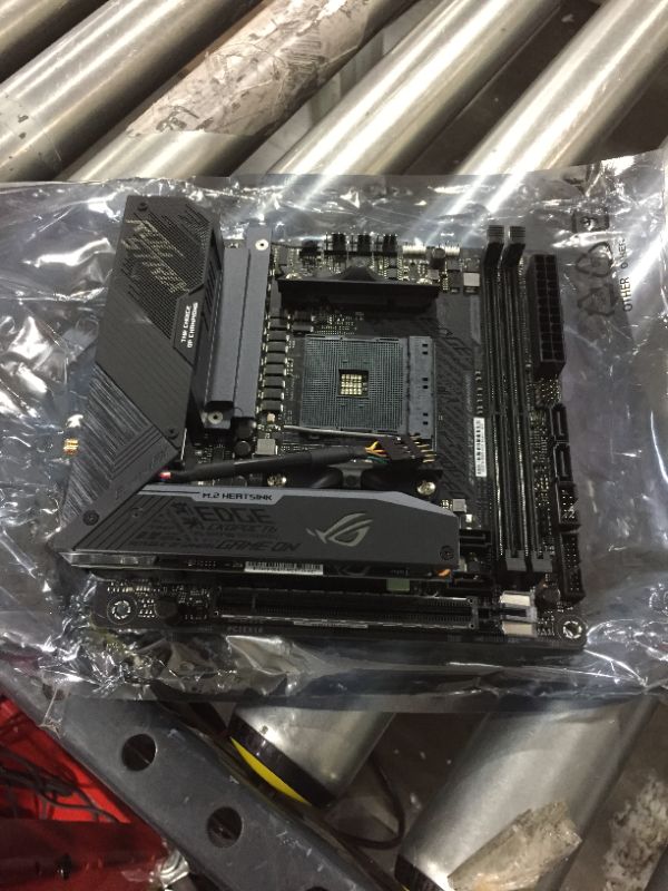 Photo 2 of ASUS ROG Strix X570-I Gaming, X570 Mini-ITX Gaming Motherboard, AMD Ryzen 3950x with PCIe 4.0, WiFi 6 (802.11ax), Intel Gigabit Ethernet, SATA 6Gb/s
