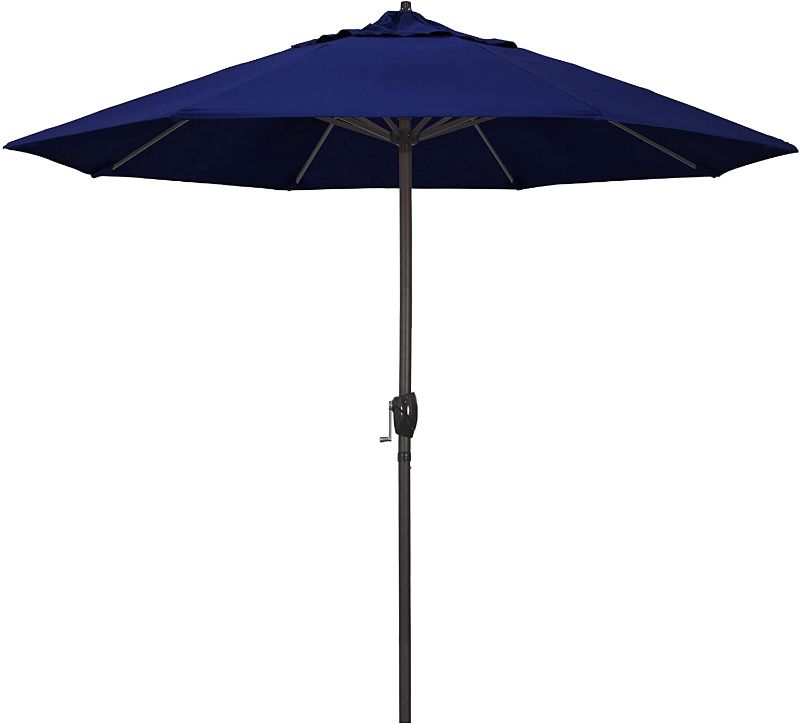 Photo 1 of California Umbrella ATA908117-5499 9' Round Aluminum Market, Crank Lift, Auto Tilt, Bronze Pole, Sunbrella True Blue Patio Umbrella, Rd
