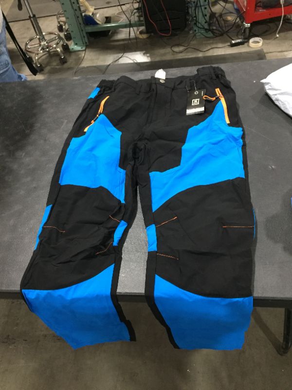 Photo 1 of Size 4XL blue and black windbreaking cargos 