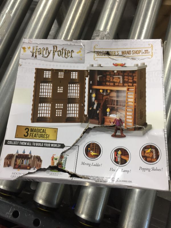 Photo 3 of HARRY POTTER Ollivander's Wand Shop Mini Playset, Includes HP and Mr. Ollivander Figures! with 3 Magical Features
