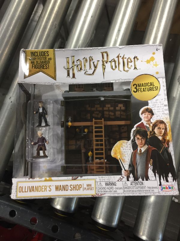 Photo 4 of HARRY POTTER Ollivander's Wand Shop Mini Playset, Includes HP and Mr. Ollivander Figures! with 3 Magical Features
