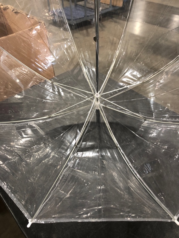 Photo 3 of CLEAR PLASTIC UMBRELLA. 