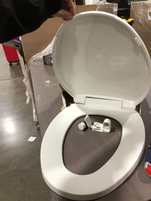 Photo 1 of  Elongated toilet seat white