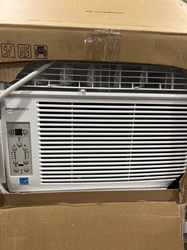 Photo 2 of Amazon basics window-mounted Air conditioner with remote 