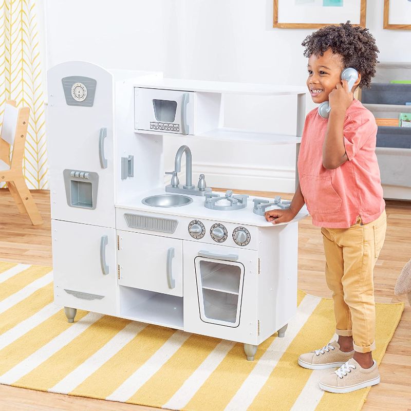 Photo 1 of KidKraft Vintage Wooden Play Kitchen with Pretend Ice Maker and Play Phone, White, Gift for Ages 3+
