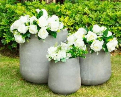 Photo 1 of 17.3 in. Tall Natural Lightweight Concrete Footed Tulip Outdoor Round Planter ONLY 1
