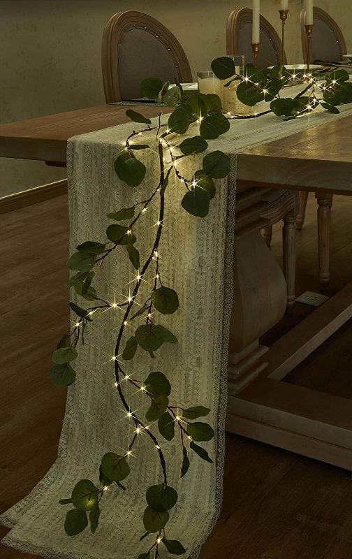 Photo 1 of Hairui Lighted Artificial Eucalyptus Garland 6FT 96 LED Battery Operated Faux Vine Lights with Timer for Wedding Backdrop Arch Wall Decor
