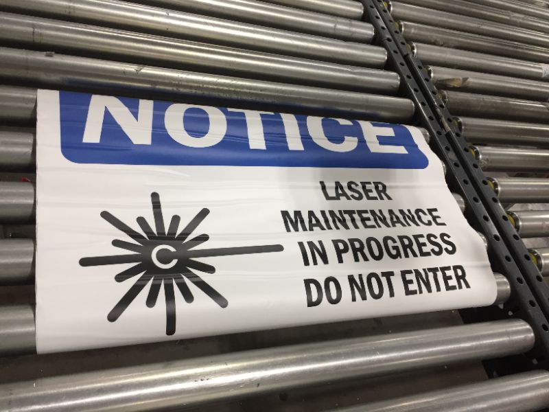 Photo 1 of 15" x 24": laser in proggress adhesive warning 